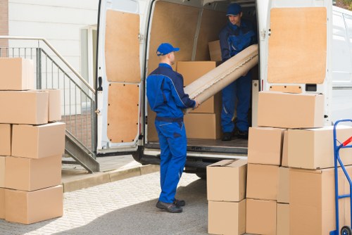 Professional house removals planning in Hackneymarshes with moving boxes and furniture